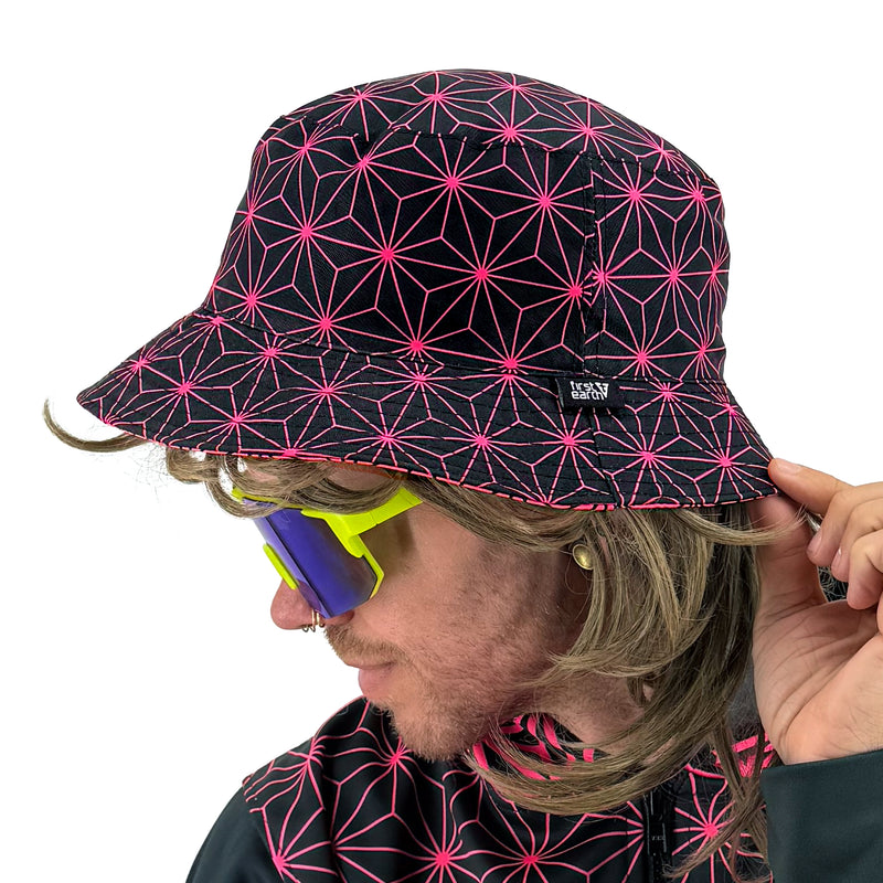 Asanoha pink UV bucket hat by First Earth – glowing sacred geometry rave hat that shines under blacklight, lightweight and perfectly portable for festival adventure