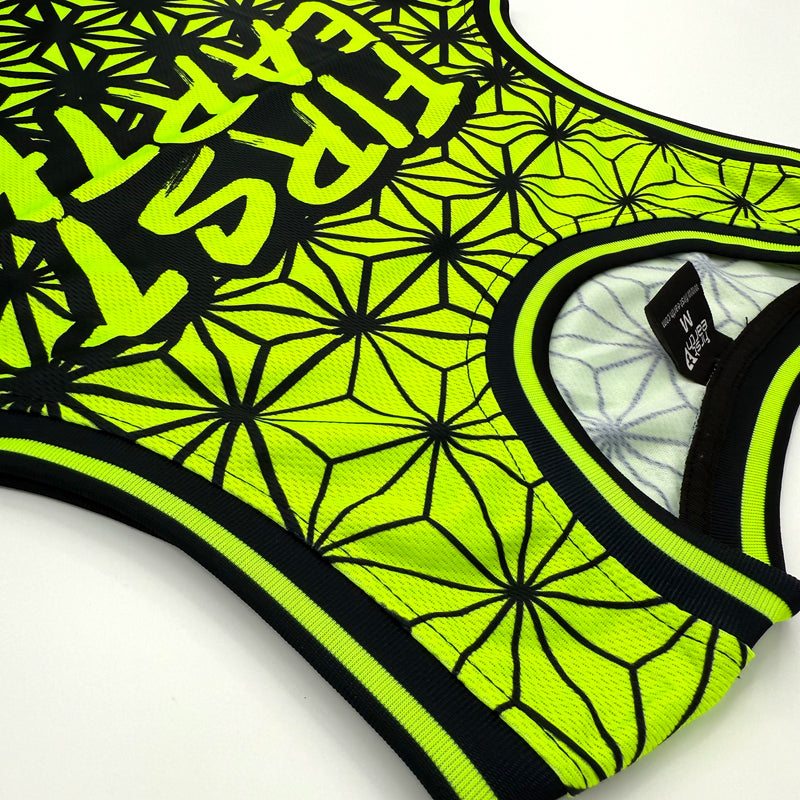 Asanoha yellow UV basketball jersey by First Earth – breathable rave jersey with glowing Asanoha geometric pattern on mesh fabric