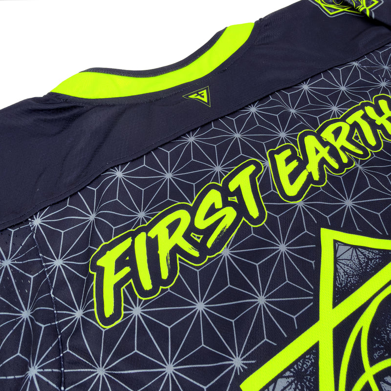 Close-up of the back neckline on First Earth UV green and grey asanoha hockey jersey with First Earth logo