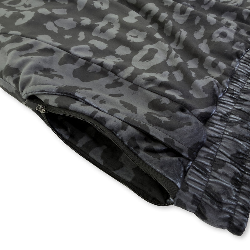 First Earth Midnight Cheetah jogger shorts close up showing side zipper pocket and dark velvet fabric