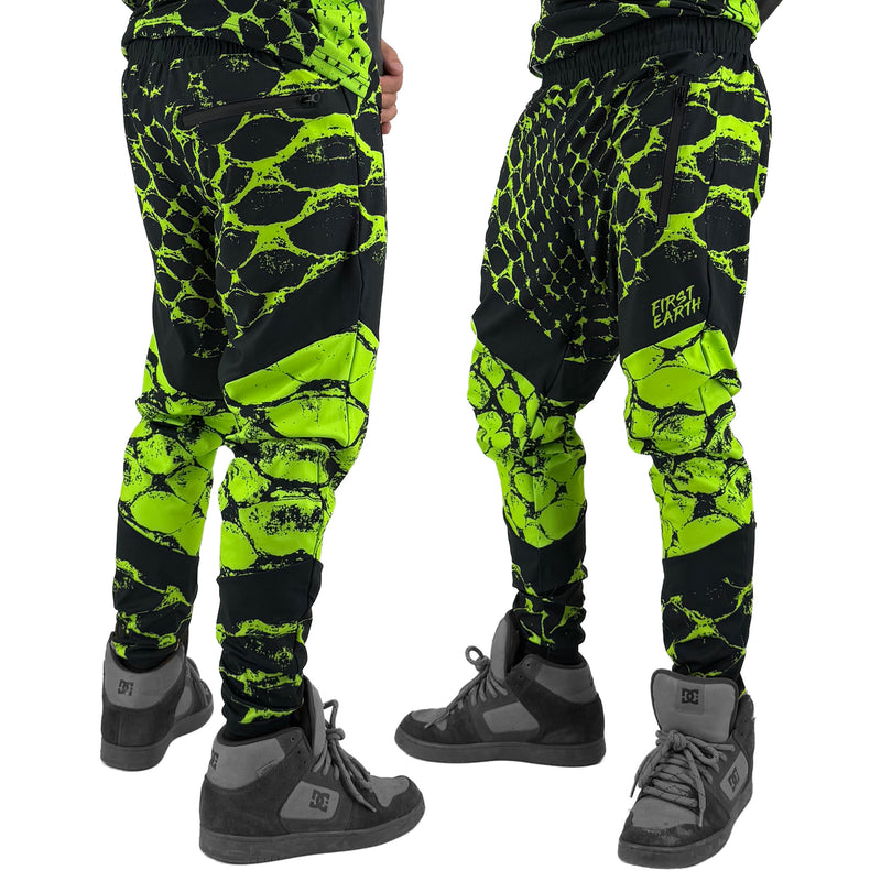 Neon Serpent UV joggers by First Earth – rave-worthy pants with glowing serpent design under blacklight, breathable soft polyester, zip pockets, and elastic drawstring waistband