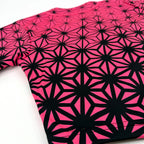Asanoha pink UV crop baseball jersey by First Earth – cropped rave tee that glows under blacklight, featuring delicate Asanoha geometry on breathable fabric 