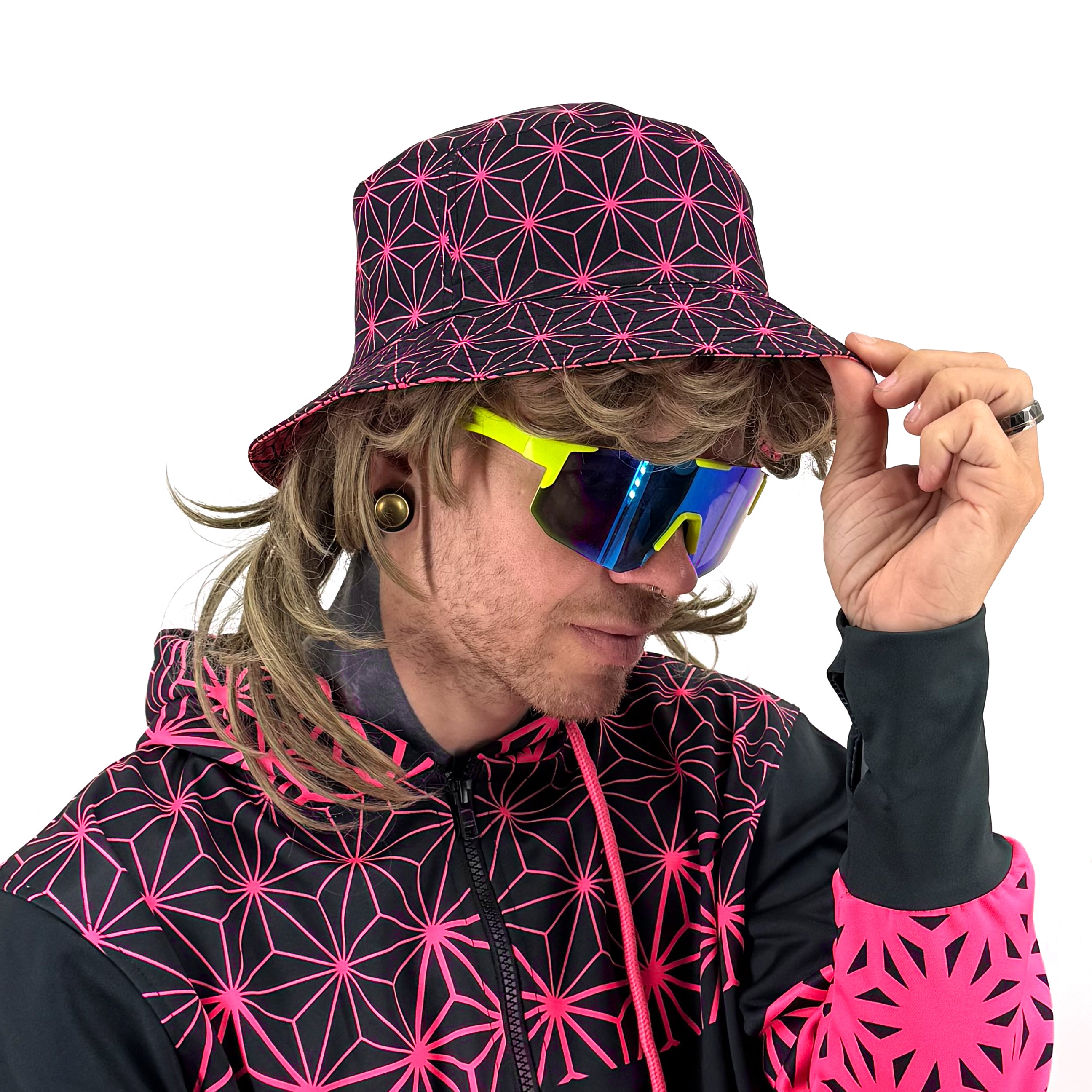 Asanoha pink UV bucket hat by First Earth – glowing sacred geometry rave hat that shines under blacklight, lightweight and perfectly portable for festival adventure 