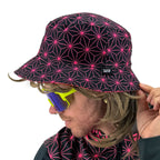 Asanoha pink UV bucket hat by First Earth – glowing sacred geometry rave hat that shines under blacklight, lightweight and perfectly portable for festival adventure 