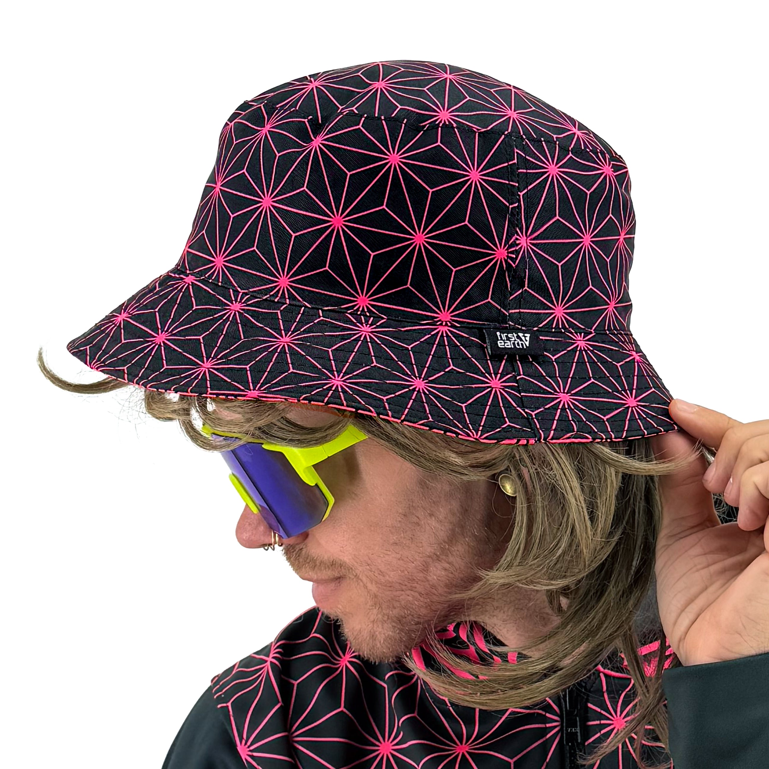Asanoha pink UV bucket hat by First Earth – glowing sacred geometry rave hat that shines under blacklight, lightweight and perfectly portable for festival adventure 