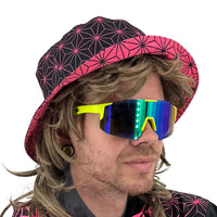 Asanoha pink UV bucket hat by First Earth – glowing sacred geometry rave hat that shines under blacklight, lightweight and perfectly portable for festival adventure 