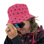 Asanoha pink UV bucket hat by First Earth – glowing sacred geometry rave hat that shines under blacklight, lightweight and perfectly portable for festival adventure 