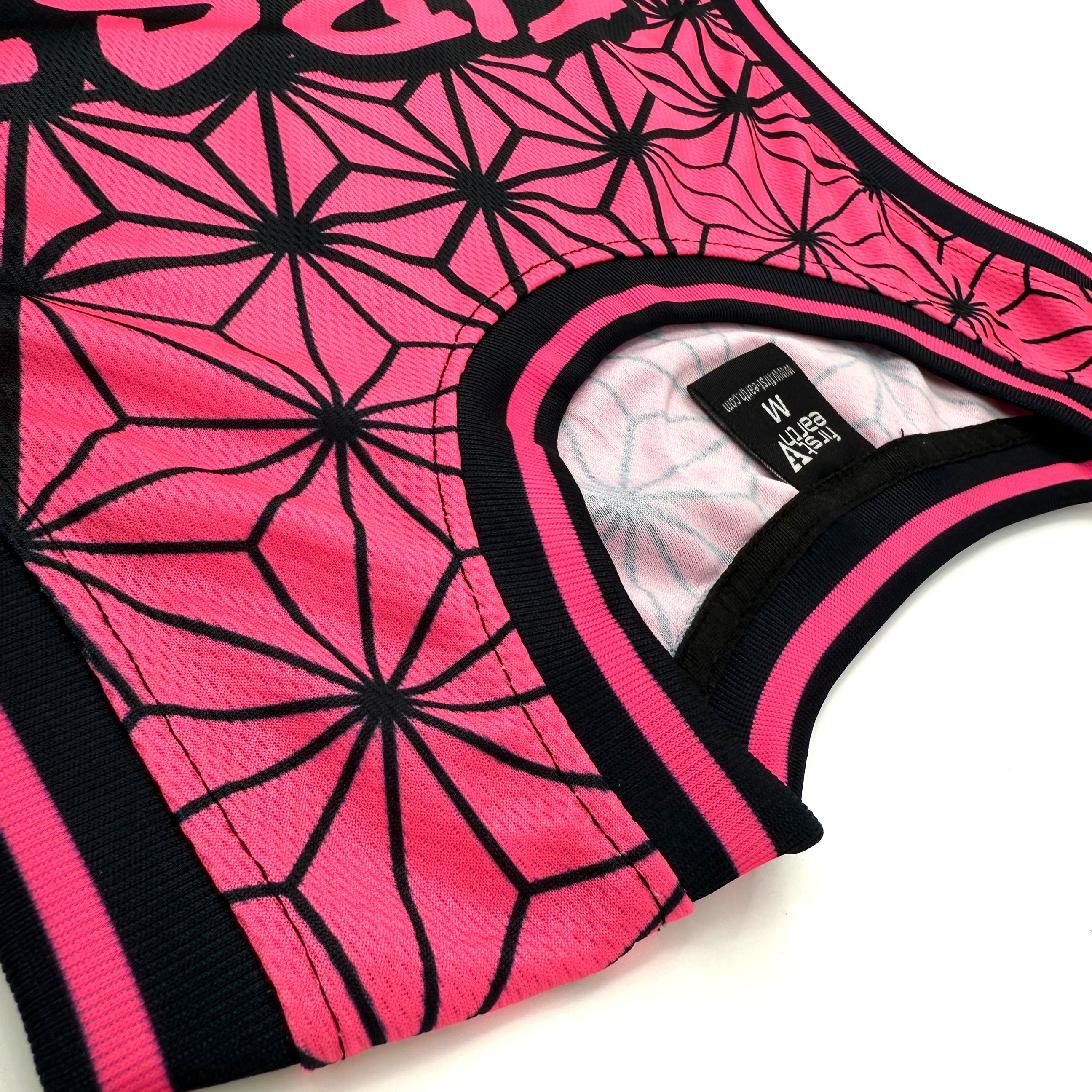 Asanoha pink UV basketball jersey by First Earth – lightweight mesh rave jersey with sacred geometry design that glows under blacklight 