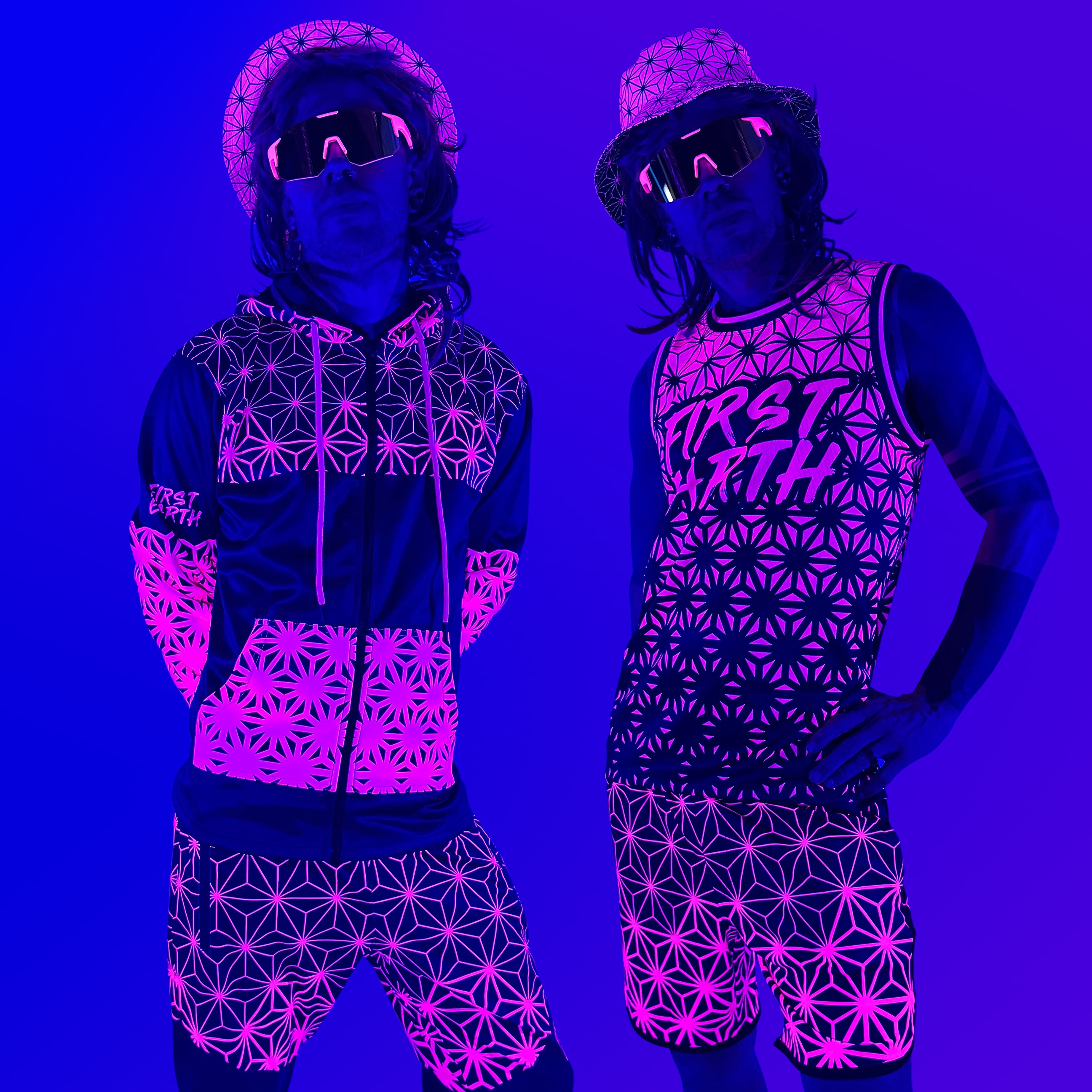 Asanoha pink UV apparel set by First Earth – rave-ready collection featuring matching jerseys, hoodie, hat, shorts, and joggers with glowing sacred geometry design that shines under blacklight