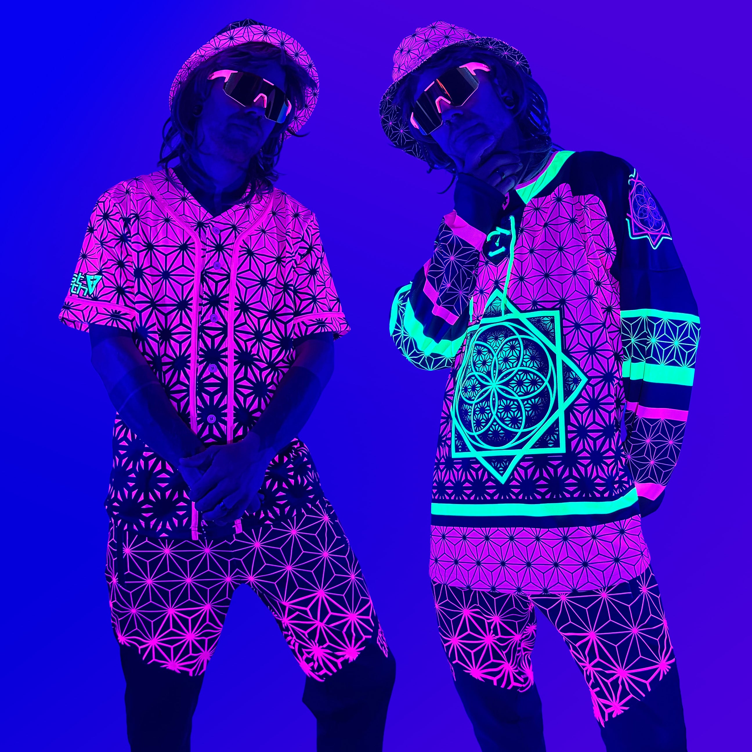 Asanoha pink UV apparel by First Earth – rave-ready collection including hoodies, jerseys, joggers, and hats with glowing sacred geometry design that shines under blacklight