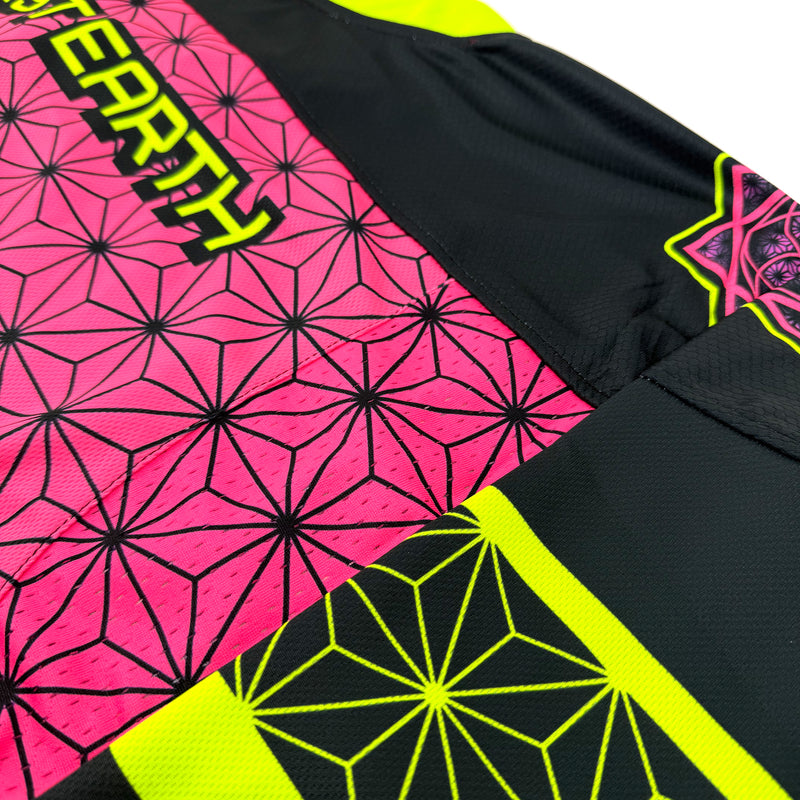 Flower of Life UV pink hockey jersey by First Earth – oversized rave jersey with sacred geometry Flow Star design that glows under blacklight