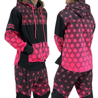 Asanoha pink UV zip‑up hoodie by First Earth – cozy rave hoodie featuring glowing sacred geometry, thumb holes, and relaxed scoop hem for festival layering 