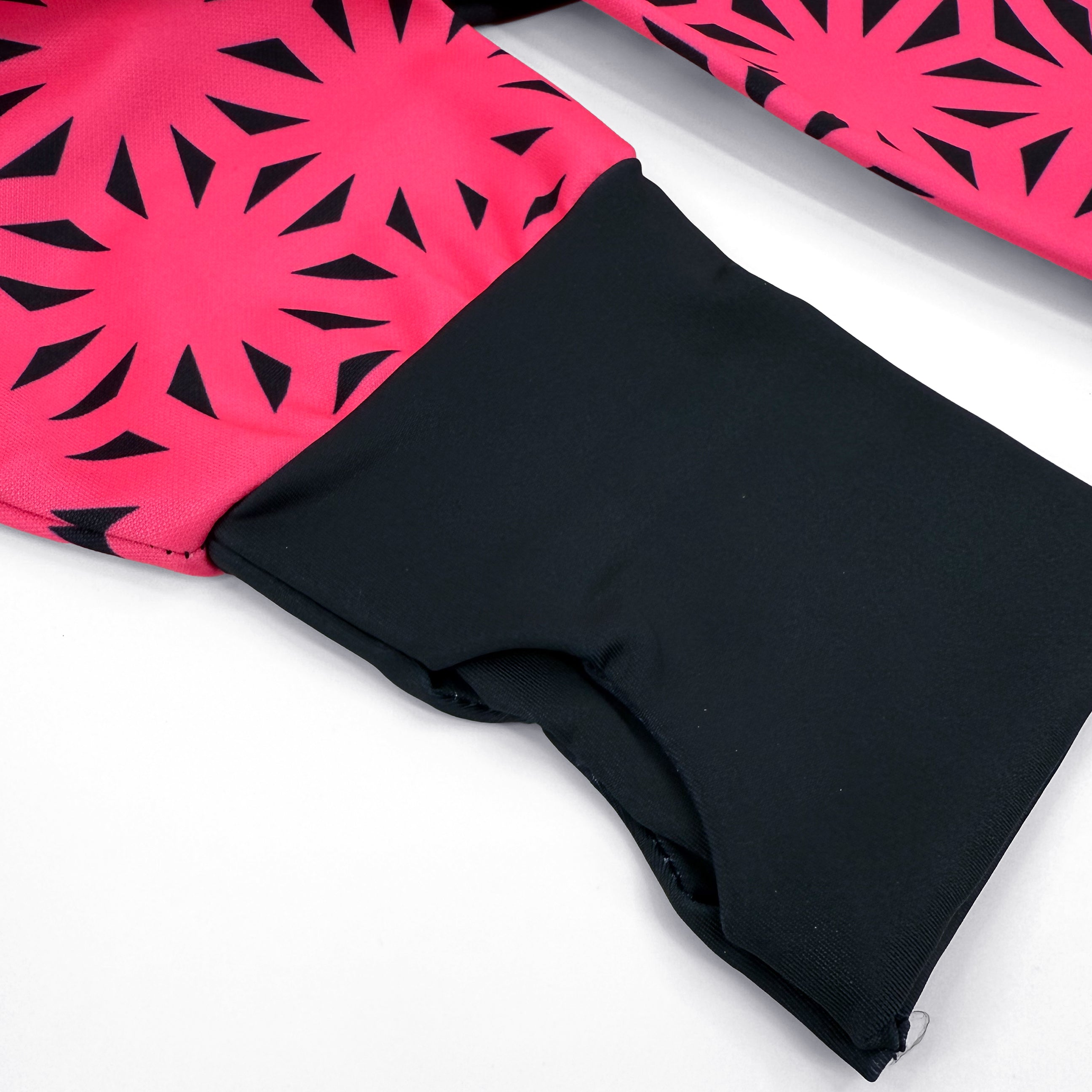 Asanoha pink UV zip‑up hoodie by First Earth – cozy rave hoodie featuring glowing sacred geometry, thumb holes, and relaxed scoop hem for festival layering 