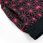 Asanoha pink UV joggers by First Earth – festival-friendly pants with glowing sacred geometry design, breathable fabric, zip pockets, and relaxed fit waistband 