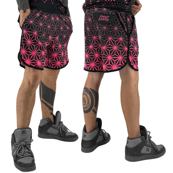 Asanoha pink UV shorts by First Earth – rave-ready shorts with glowing sacred geometry design under blacklight, soft breathable fabric, zip and velcro pockets for hands-free flow