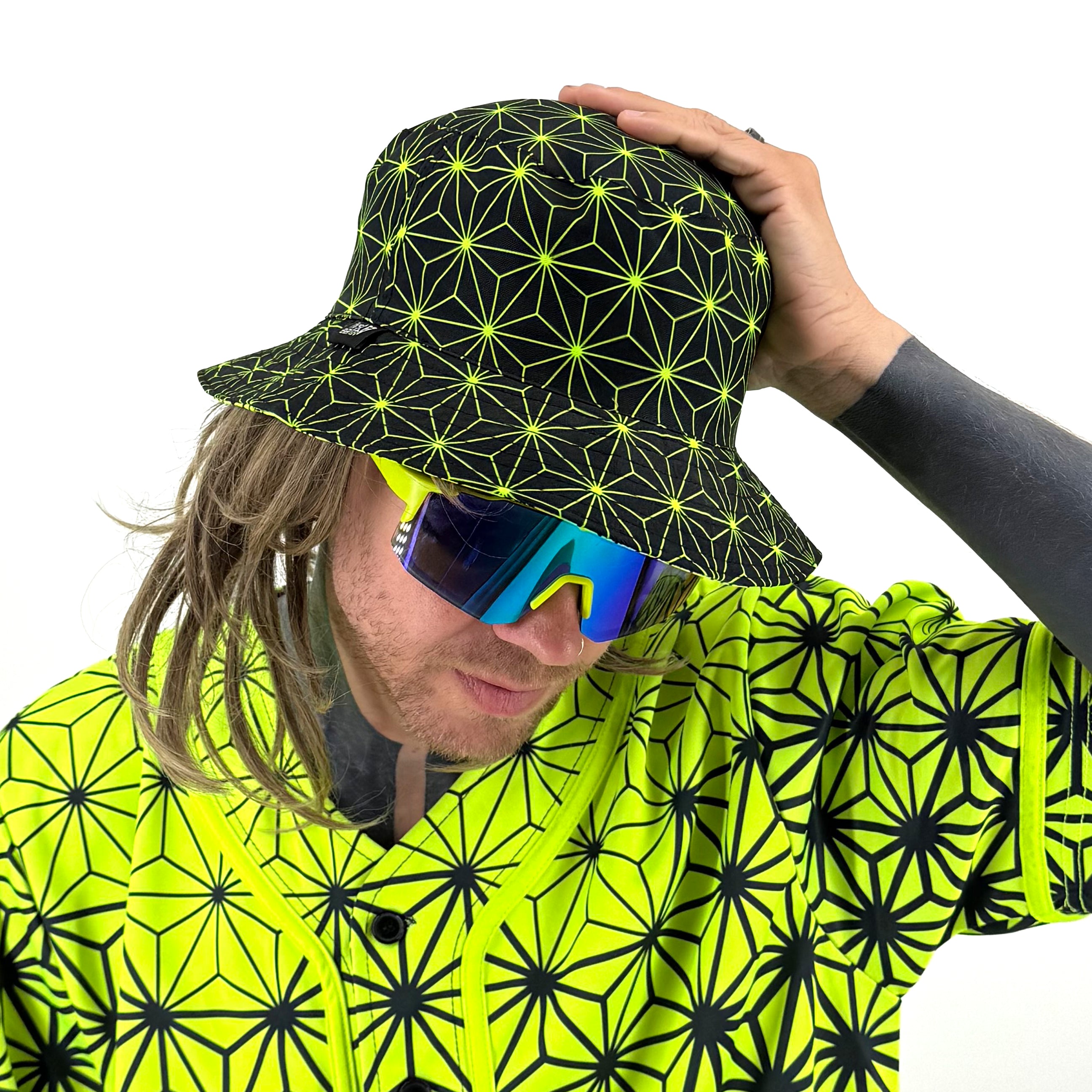 Asanoha yellow UV bucket hat by First Earth – rave-ready hat with glowing sacred geometry pattern, lightweight and breathable for all-night festival wear 