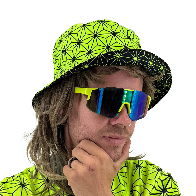 Asanoha yellow UV bucket hat by First Earth – rave-ready hat with glowing sacred geometry pattern, lightweight and breathable for all-night festival wear 