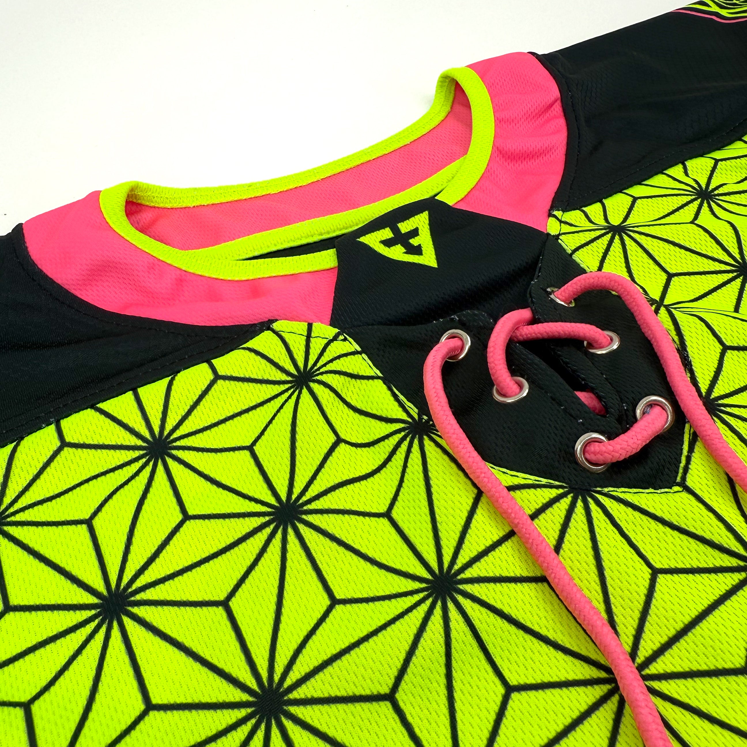 Flower of Life UV green hockey jersey by First Earth – oversized rave jersey featuring glowing sacred geometry Flow Star artwork for festivals