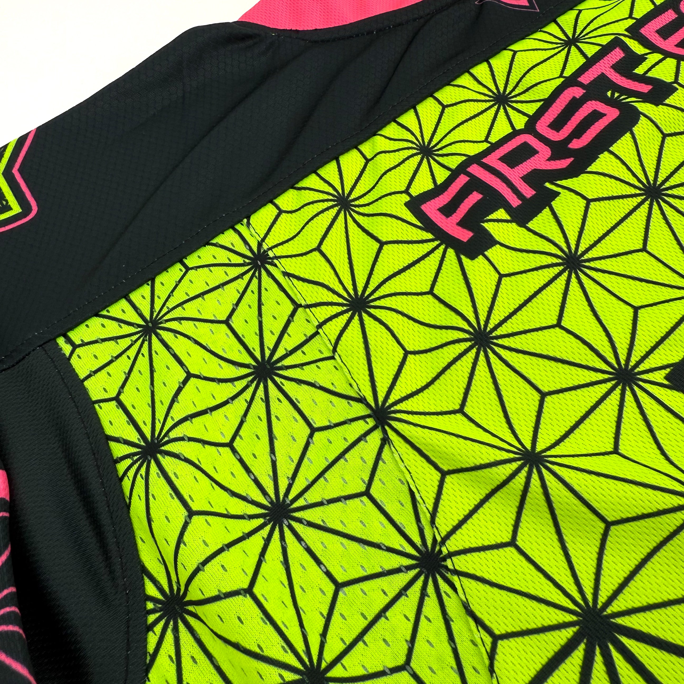 Flower of Life UV green hockey jersey by First Earth – oversized rave jersey featuring glowing sacred geometry Flow Star artwork for festivals