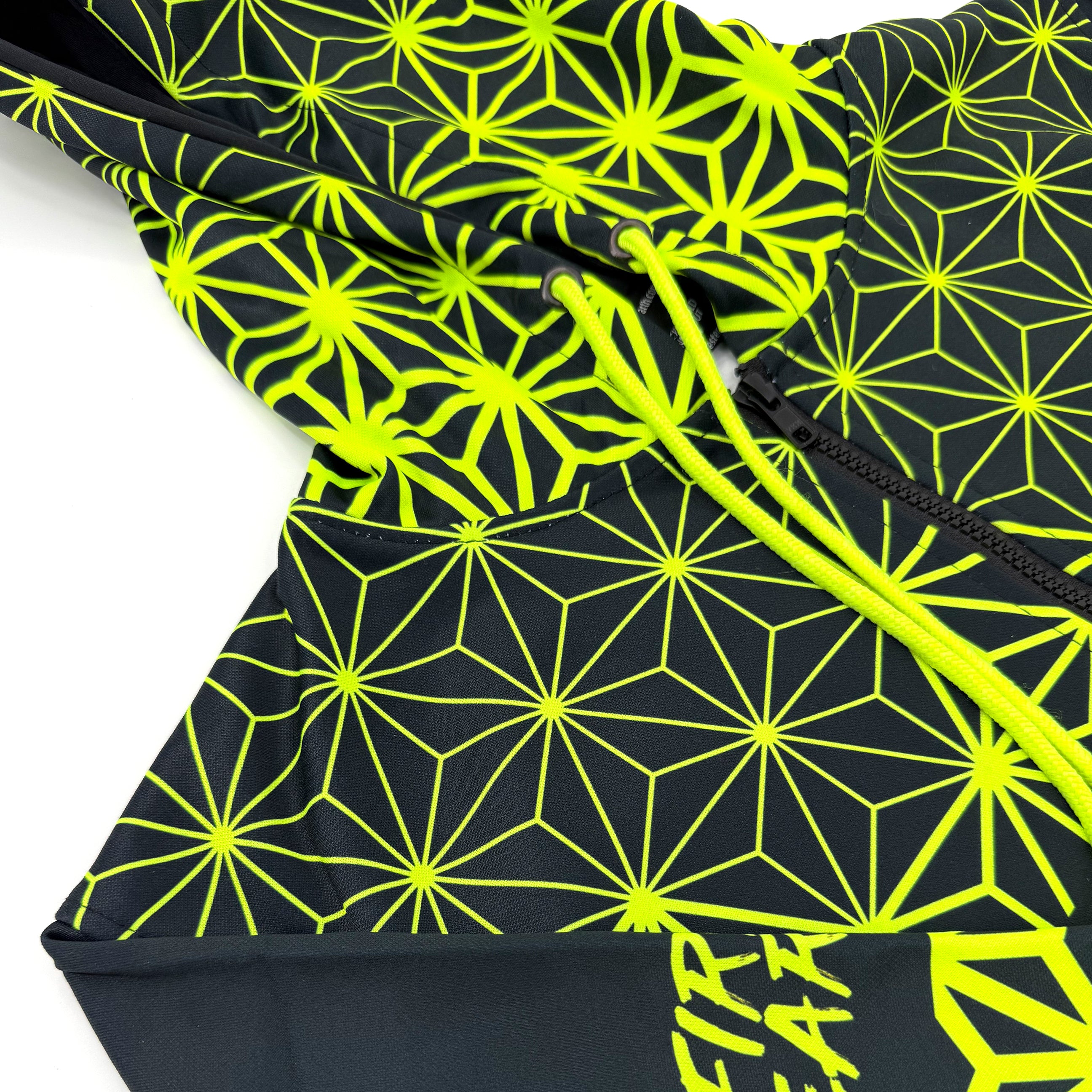 Asanoha yellow UV zip‑up hoodie by First Earth – rave-ready hoodie with glowing sacred geometry design under blacklight, thumb holes, and relaxed scoop hem for comfortable layering 