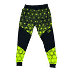 Asanoha yellow UV joggers by First Earth – rave-ready pants with glowing Asanoha sacred geometry, soft breathable polyester, zip pockets, and comfortable elastic waistband 