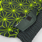 Asanoha yellow UV shorts by First Earth – rave-ready shorts featuring glowing sacred geometry design under blacklight, lightweight and breathable with practical pockets