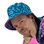 Neon Cheetah UV rave bucket hat with bold print that glows under blacklight at festivals