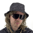 First Earth Midnight Cheetah velvet bucket hat front view on model with dark grey black leopard print