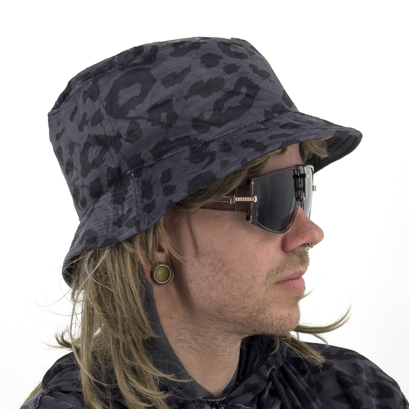 First Earth Midnight Cheetah velvet bucket hat side profile showing dark grey black leopard print and brim