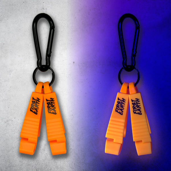 Neon orange First Earth Flow Star carabiner shown in daylight and glowing under blacklight