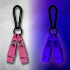Pink First Earth Flow Star carabiner shown in daylight and glowing violet under blacklight