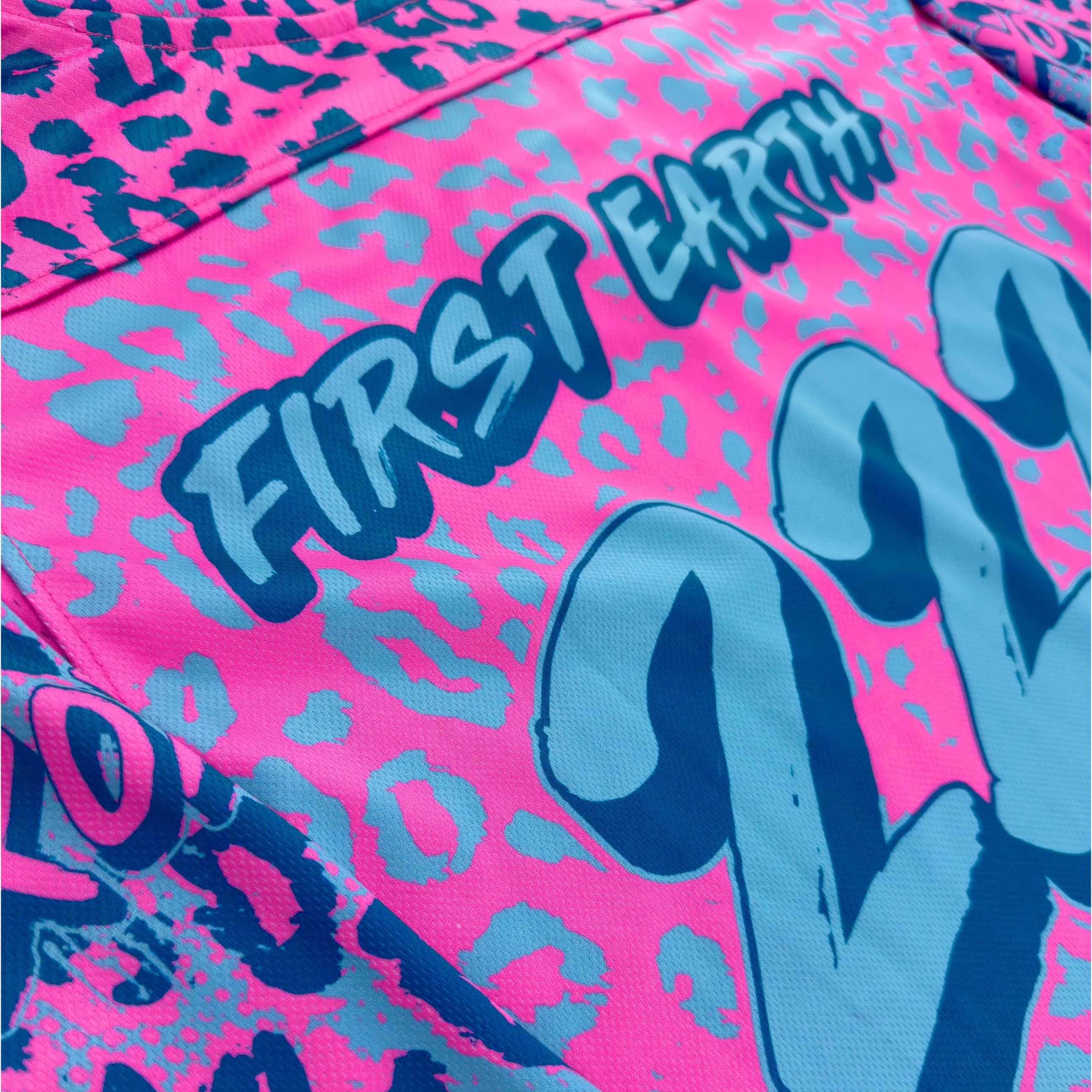 Neon Cheetah UV rave hockey jersey with bold animal print that glows under blacklight for festivals