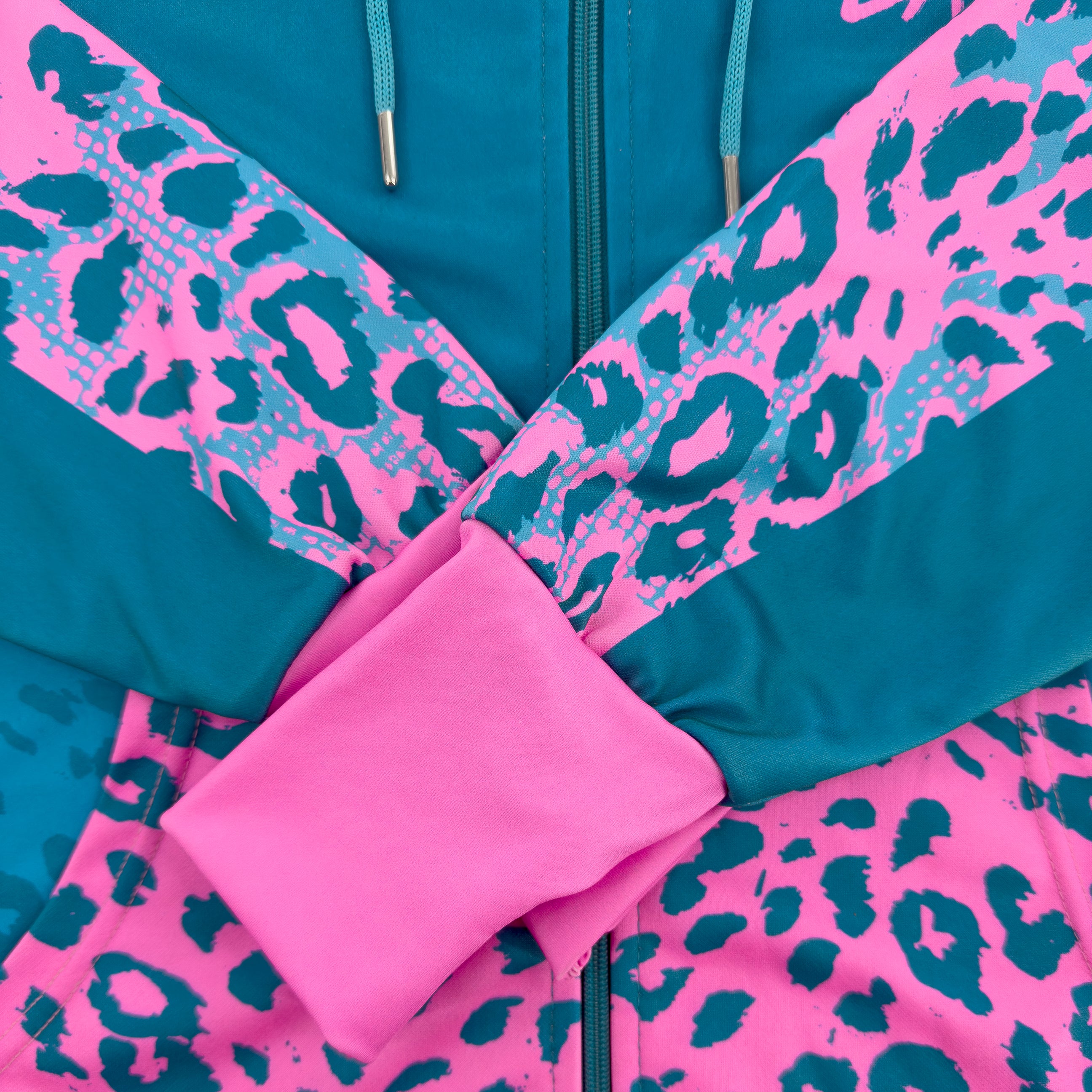 Neon Cheetah UV rave zip up hoodie with bold print that glows under blacklight at festivals