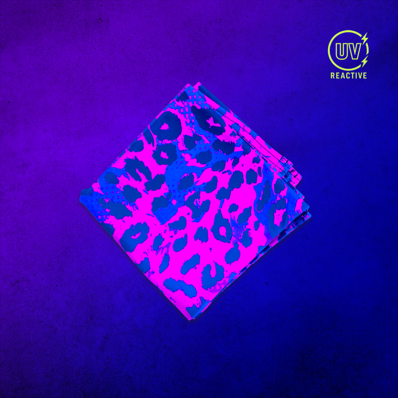 Neon Cheetah - UV Glow - Bandana glowing under black light, showing the UV-reactive colors and complete printed design