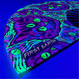 Cheshire Cat UV glow hand fan by First Earth – collapsible rave fan with glowing Cheshire Cat design, bamboo ribs, and vibrant polyester fabric for festival breeze