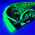 Flower of Life UV glow hand fan green by First Earth – folding rave fan with sacred geometry glowing under blacklight, bamboo handle, vibrant polyester fabric