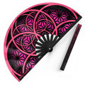 Flower of Life UV glow pink hand fan by First Earth – portable rave fan with glowing sacred geometry print, bamboo ribs, and vibrant polyester fabric for festival flair