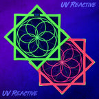UV reactive Flower of Life Flow Star glowing under blacklight, showing the neon green and pink versions fluorescing against a purple background.