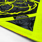 Close-up fabric and stitching detail of the Flower of Life Midnight Flow Star with neon yellow zig-zag stitching and the First Earth Flow Star label.