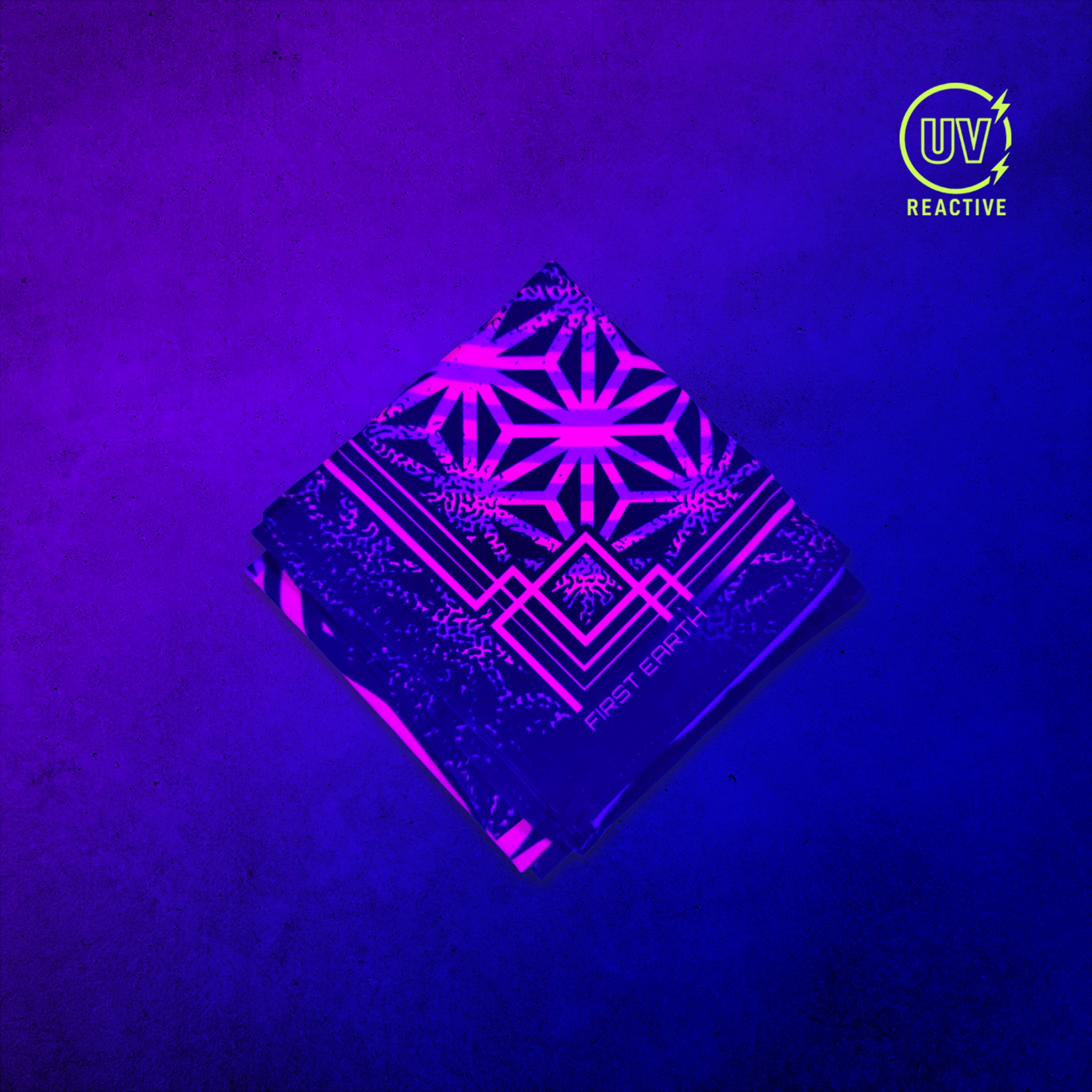 Flower of Life Pink - UV Glow - Bandana glowing under black light, showing the UV-reactive colors and complete printed design