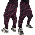 First Earth Asanoha Pink velvet harem joggers on model showing front and back views with pink geometric asanoha pattern