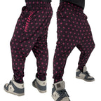 First Earth Asanoha Pink velvet harem joggers on model showing front and back views with pink geometric asanoha pattern