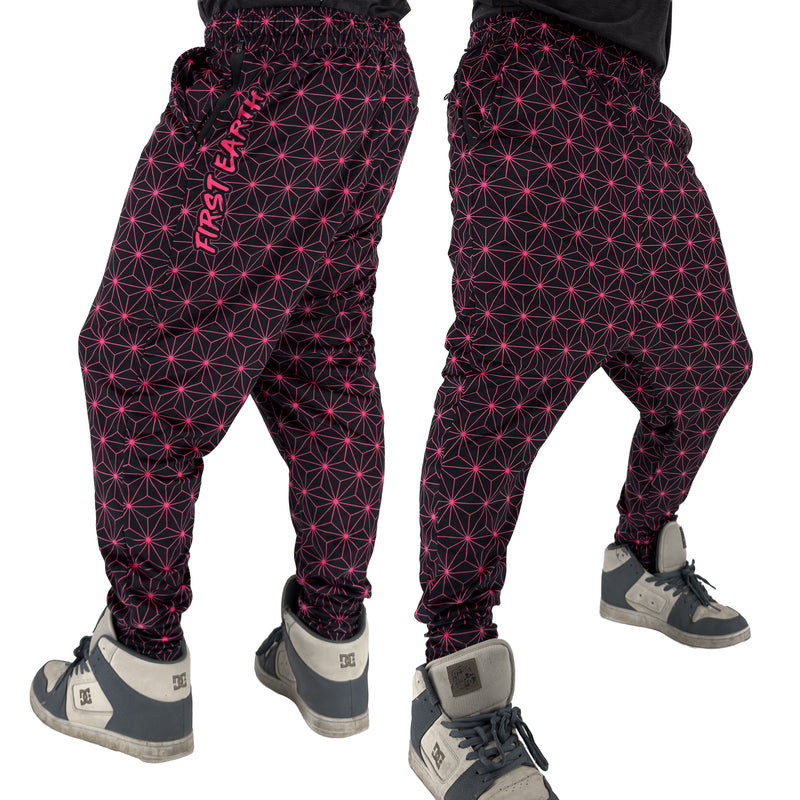First Earth Asanoha Pink velvet harem joggers on model showing front and back views with pink geometric asanoha pattern