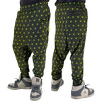 First Earth Asanoha Yellow velvet harem joggers on model showing front and back views with yellow geometric asanoha pattern