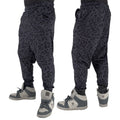 First Earth Midnight Cheetah velvet harem joggers on model showing front and back views with dark cheetah print