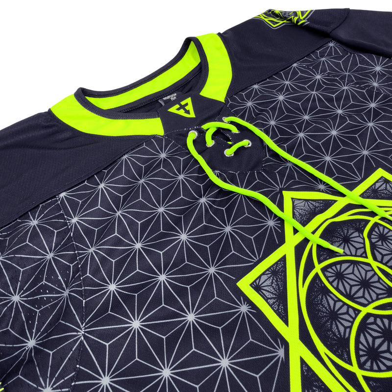 Close-up of the front neckline on First Earth UV green and grey asanoha hockey jersey with lace-up detail