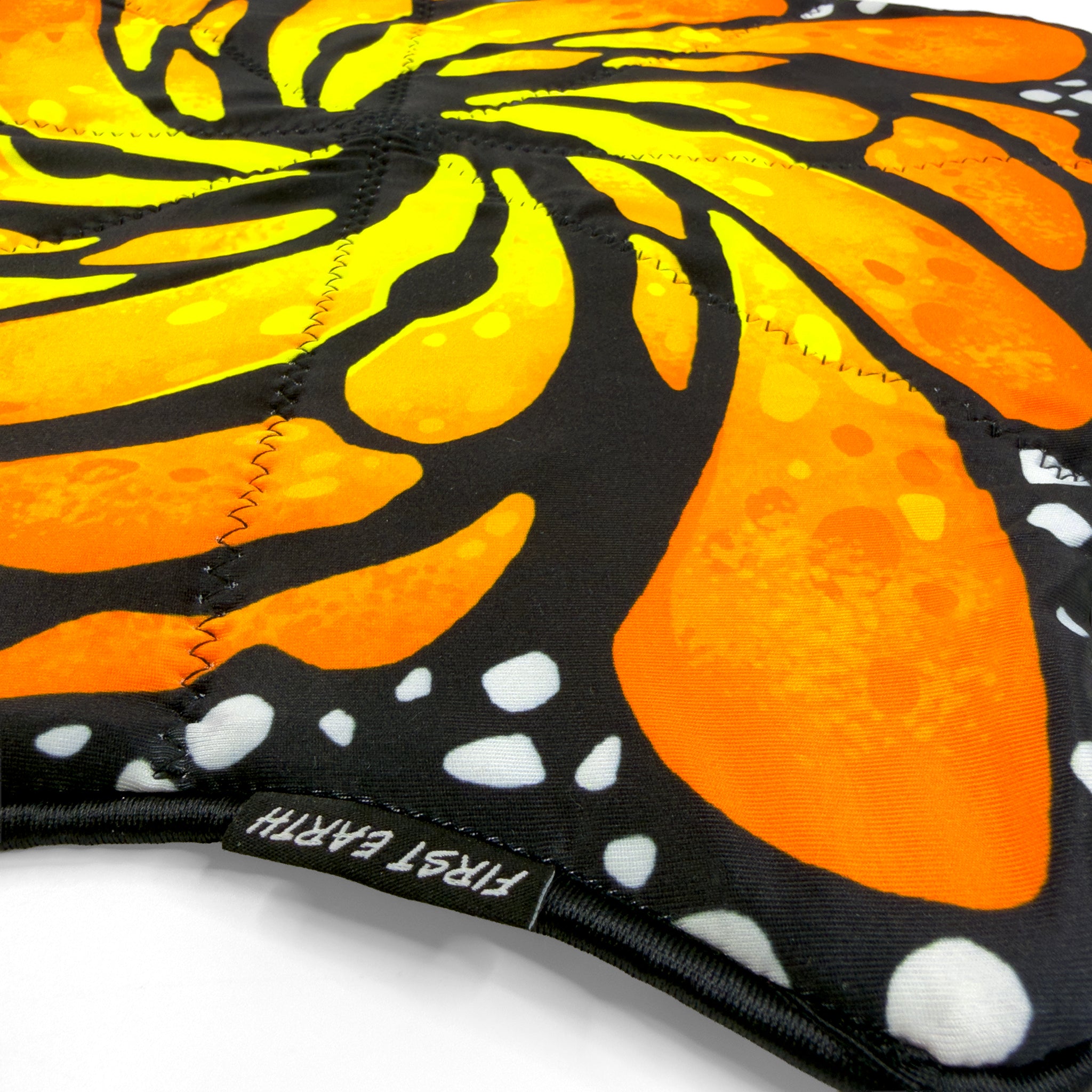 First Earth Liquid Butterfly Juice mini flowstar close up showing tag and zig zag stitching