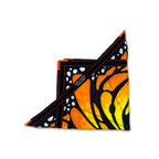 First Earth flow star folded into quarters showing orange yellow artwork and brand tag