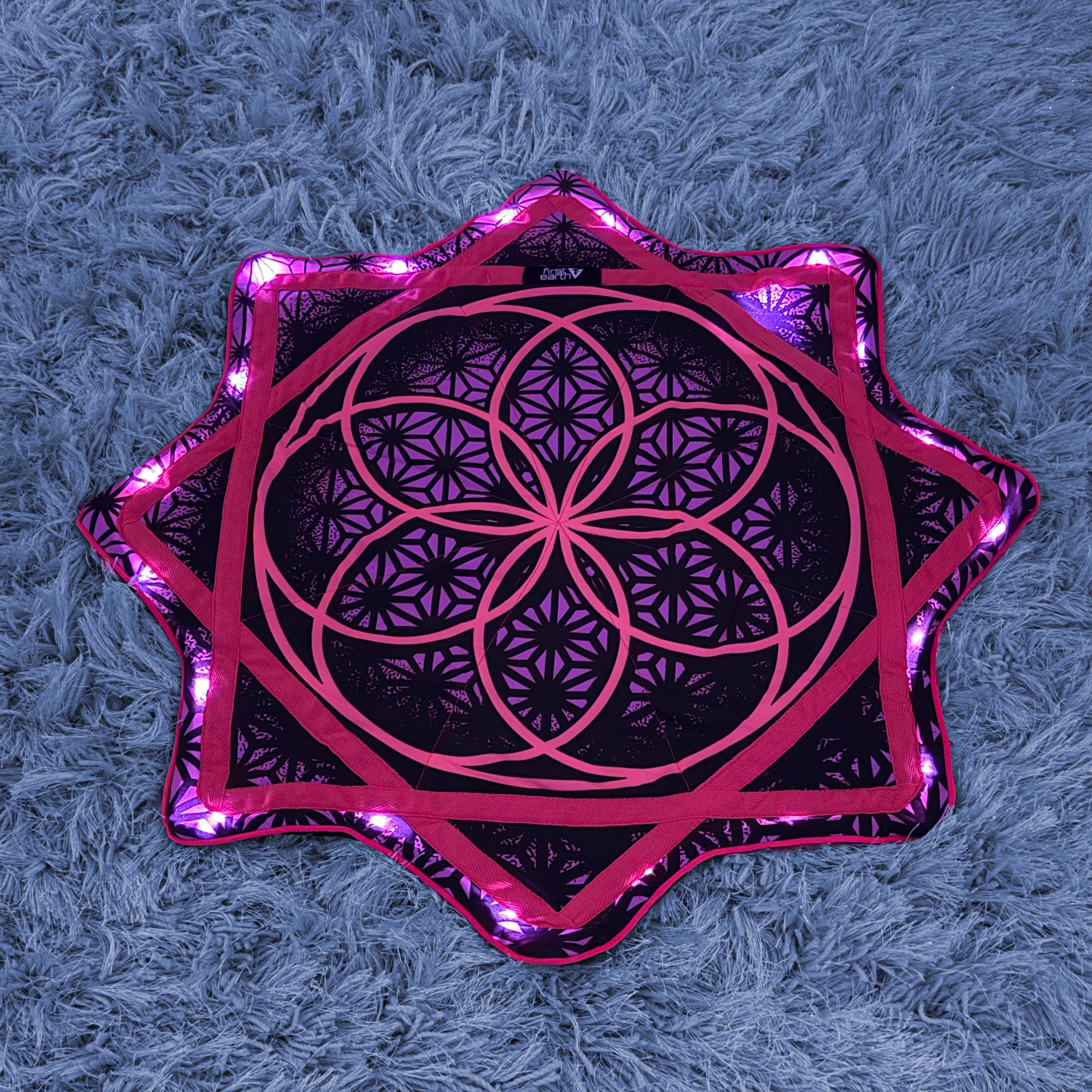 Flower of Life – UV pink LED spinning flow star by First Earth, luminous rave prop with sacred geometry 