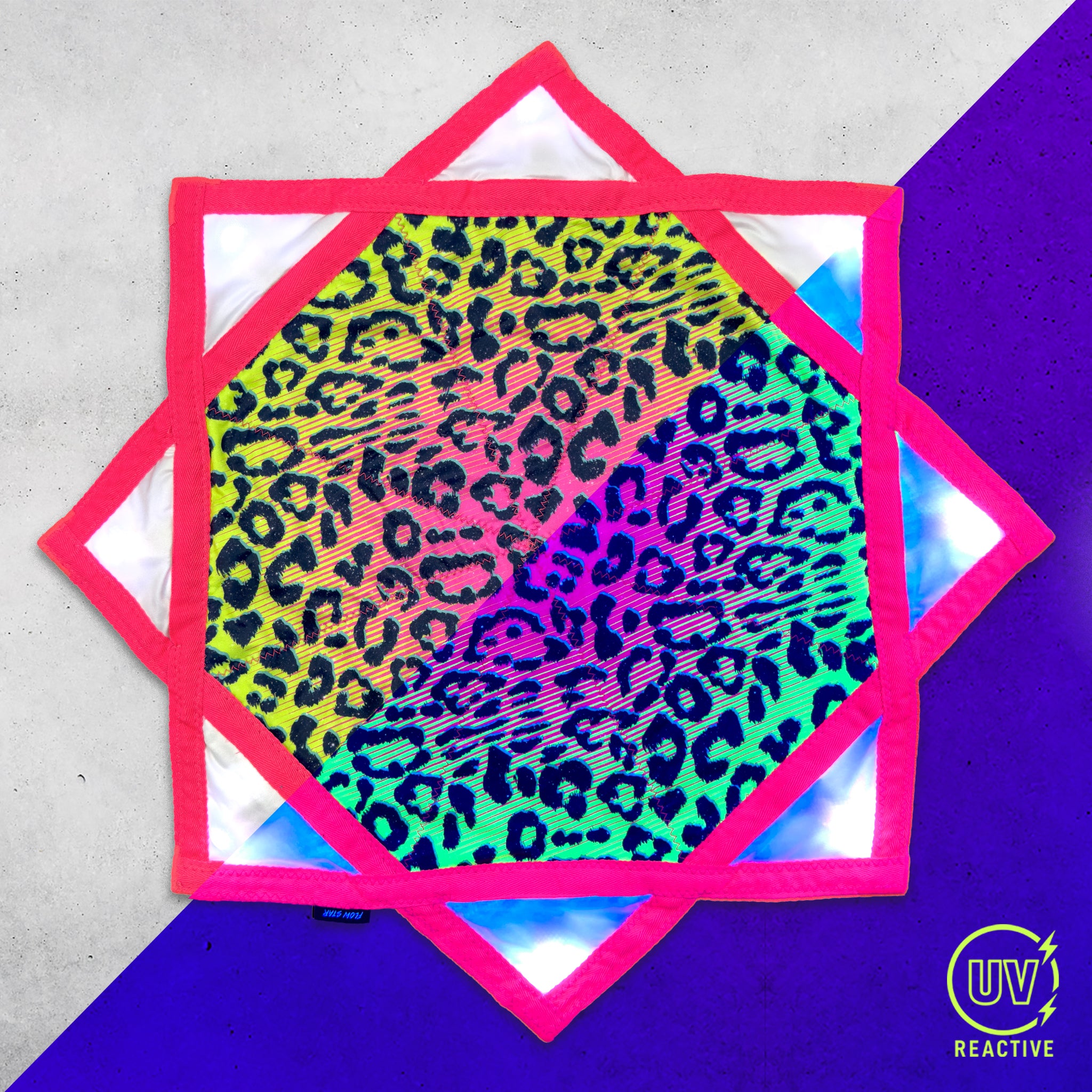 Cheshire Dreams - LED Flow Star by First Earth, illuminated view showing the colorful LED lighting across the printed fabric